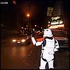 Stormtrooper hailing a yellow taxi